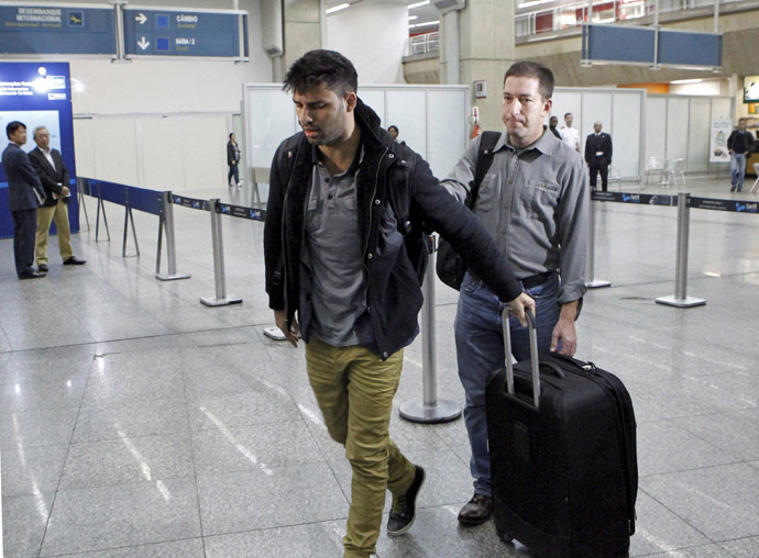 David Miranda (L) -- the Brazilian partner of Glenn Greenwald, a US journalist with Britain's Guardian newspaper who worked with intelligence leaker Edward Snowden to expose US mass surveillance programmes -- is pictured at Rio de Janeiro's Tom Jobim international airport upon his arrival on August 19, 2013. (AFP Photo/O Globo)