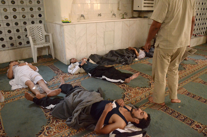 urvivors from what activists say is a gas attack rest inside a mosque in the Duma neighbourhood of Damascus August 21, 2013 (Reuters / Bassam Khabieh)