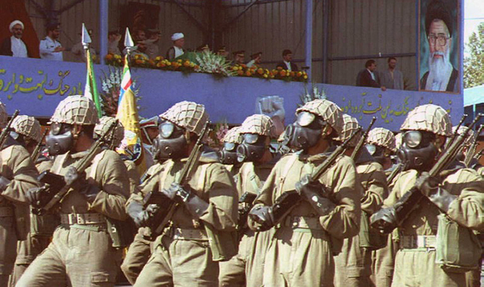 Iranian troops with equipment against chemical weapon attacks parade in front of the official stand at Tehran, 21 September, during ceremonies commemorating the war between Iran and Iraq which started with the Iraqi invasion in 1980 and ended eight years later in a stalemate. (AFP Photo)