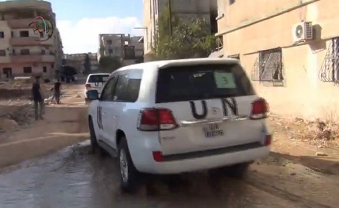 An image grab taken from a video uploaded on YouTube by Moadamiyet al-Sham media centre on August 26, 2013 allegedly shows the United Nations (UN) arms experts convoy leaving Damascus' Moadamiyet al-Sham suburb following an inspection visit on August 26 to investigate an alleged chemical weapons strike near the capital. (AFP Photo)