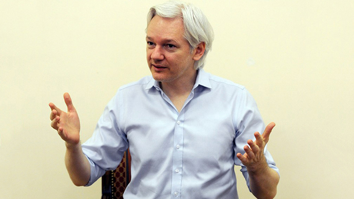 Wikileaks founder Julian Assange speaks to the media inside the Ecuadorian Embassy in London on June 14, 2013, ahead of the first anniversary of his arrival there on June 19, 2012. (AFP Photo / Anthony Devlin)