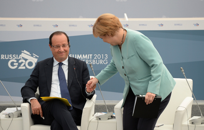 French President Francois Hollande and German Chancellor Angela Merkel attend a meeting with business leaders in St.Petersburg September 6, 2013 (Reuters / Alexei Filippov)