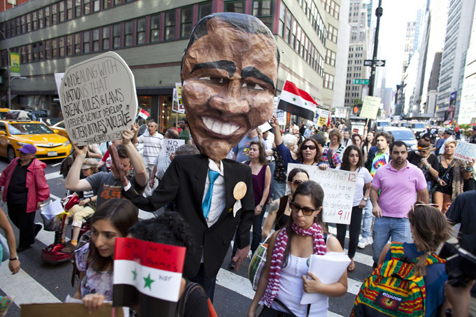 Demonstrators march after a rally on Times Square September 7, 2013 in New York City. (Ramin Talaie/Getty Images/AFP)