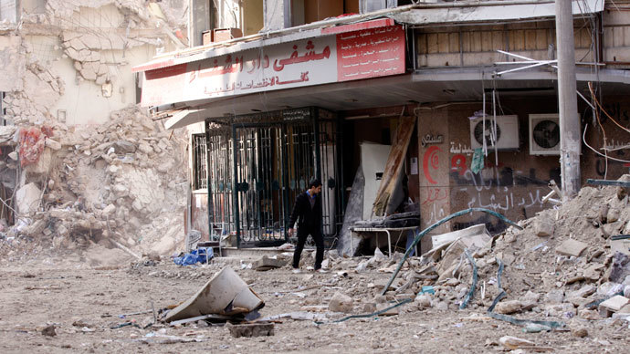 A civilian inspects the damage in front of the Dar Al Shifa hospital after shelling in Aleppo.(Reuters / Zain Karam)