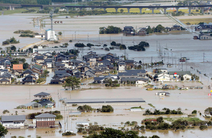 An aerial view shows residential areas flooded by the Yura river after tropical storm Man-yi, also known locally as Typhoon No.18, hit in Fukuchiyama, Kyoto prefecture, in this photo taken by Kyodo September 16, 2013.(Reuters / Kyodo)