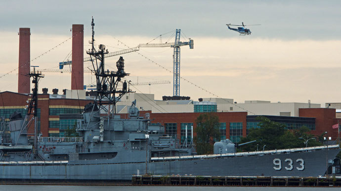 A US Park Police helicopter patrols over the US Navy Yard September 16, 2013 in Washington,DC.(AFP Photo / Paul J. Richards)