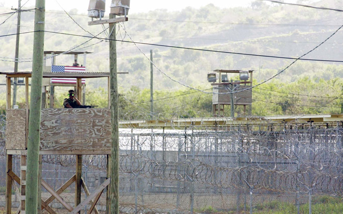 A US Marine manning an observation tower surveys the outside of Camp X-Ray where 110 Al-Qaeda and Taliban detainees are being currently held by US authorities at the US Guantanamo US Naval Base in Guantanamo Bay, Cuba (AFP Photo)