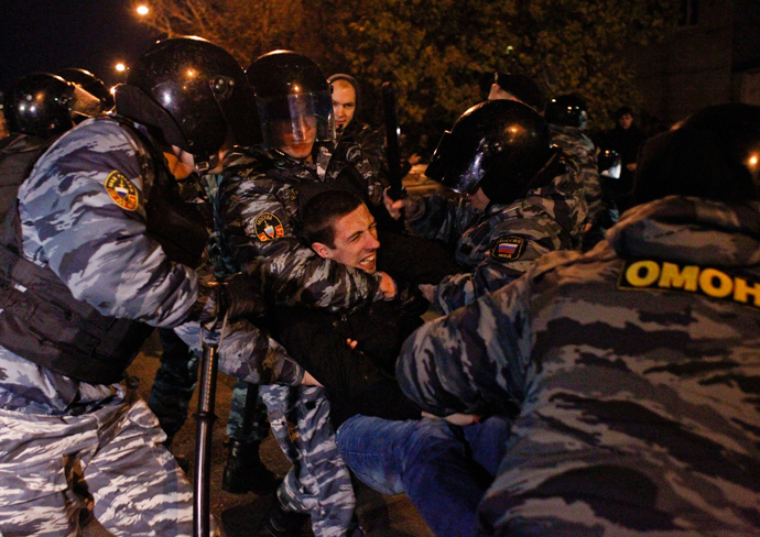 Russian police detain a man after a protest in the Biryulyovo district of Moscow October 13, 2013 (Reuters / Maxim Shemetov)