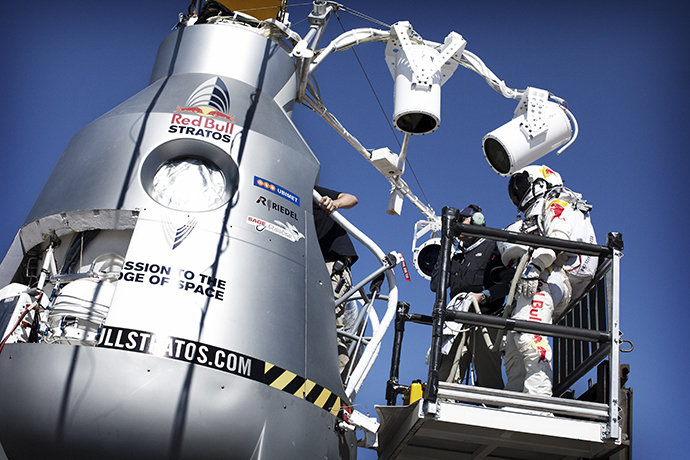 Pilot Felix Baumgartner of Austria stands on the forklift in front of the capsule during final manned flight for Red Bull Stratos in Roswell, New Mexico, USA on October 9, 2012. (Red Bull Stratos / Red Bull Content Pool)