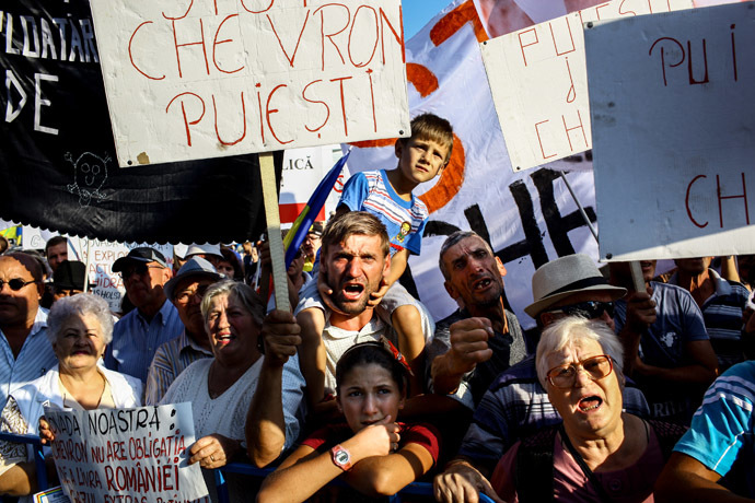 Romanians voice their protest during an anti-fracking protest in Barlad, Romania on September 1st, 2013. (AFP Photo/Andrei Pungovschi)
