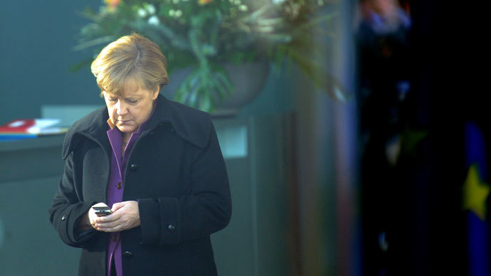 German Chancellor Angela Merkel using her mobile phone.(AFP Photo / Maurizio Gambarini)