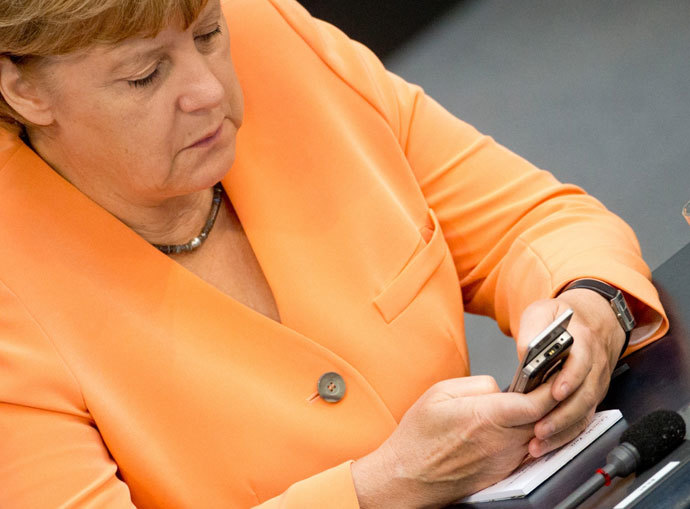 German Chancellor Angela Merkel using her mobile phone.(AFP Photo / Kay Nietfeld)