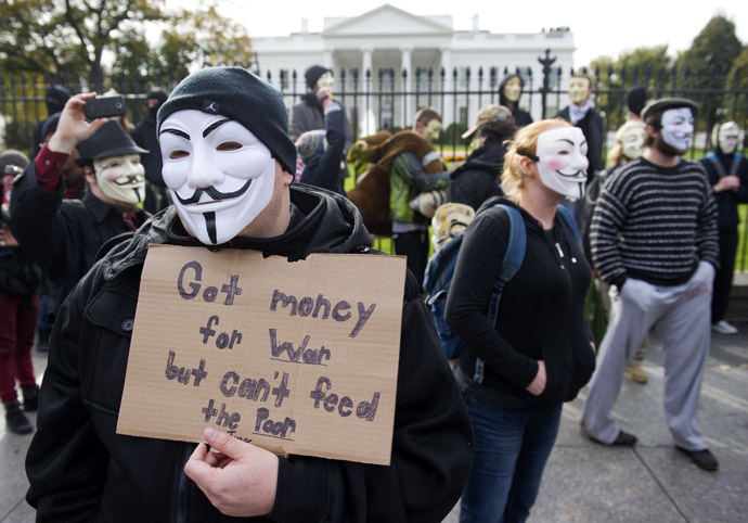 Demonstrators, including supporters of the group Anonymous, march in a protest against corrupt governments and corporations in front of the White House in Washington, DC, November 5, 2013, as part of a Million Mask March of similar rallies around the world on Guy Fawkes Day. (AFP Photo/Saul Loeb)
