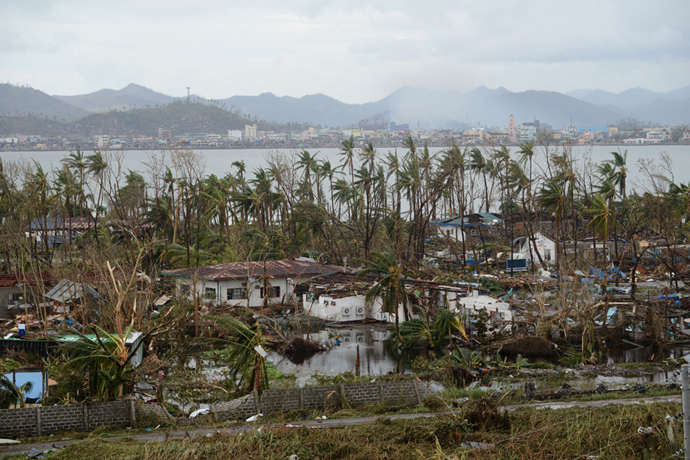 A general shot shows fallen trees and destroyed houses in the aftermath of Super Typhoon Haiyan in Tacloban, eastern island of Leyte on November 9, 2013. (AFP Photo / Noel Celis)