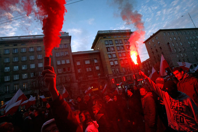 Far-right protesters light flares during their annual march, which coincides with Poland's national Independence Day in Warsaw November 11, 2013. (Reuters / Kacper Pempel)