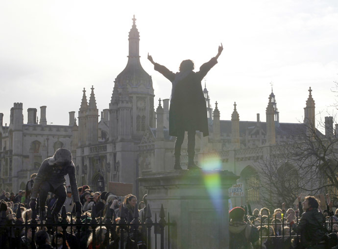 A demonstrator gestures as students occupy the grounds of Senate House at Cambridge University, in Cambridge eastern England November 24, 2010. (Reuters/Darren Staples)