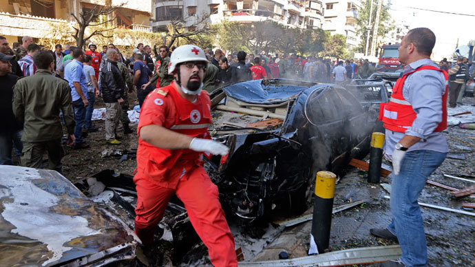 Soldiers, policemen and medical personnel gather at the site of explosions near the Iranian embassy in Beirut November 19, 2013.(Reuters / Hasan Shaaban)