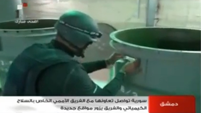 An image grab taken from Syrian television on October 19, 2013 shows an inspectors from the Organisation for the Prohibition of Chemical Weapons (OPCW) at work at an undisclosed location in Syria. (AFP Photo)