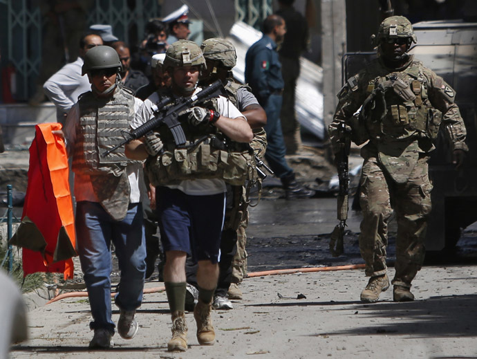 NATO soldiers with the International Security Assistance Force (ISAF) arrive at the site of a suicide attack in Kabul May 16, 2013. (Reuters/Mohammad Ismail)