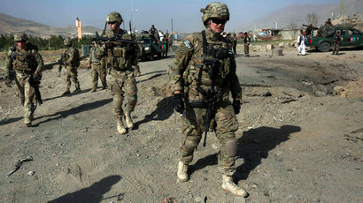 Afghan, US officials sign long-awaited pact to ensure troops stay past 2014
