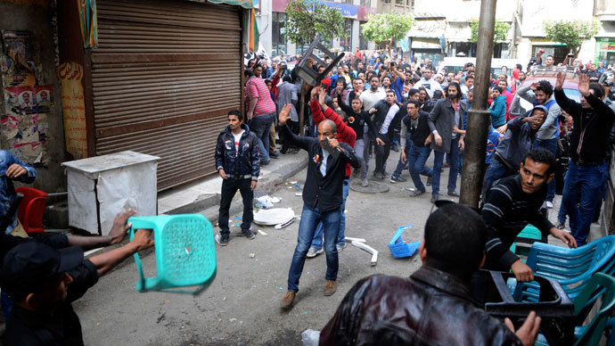 Activists and supporters of Ahmed Maher, founder of the April 6 movement, clash with security forces outside Abdeen court in Cairo November 30, 2013.(Reuters / Stringer)
