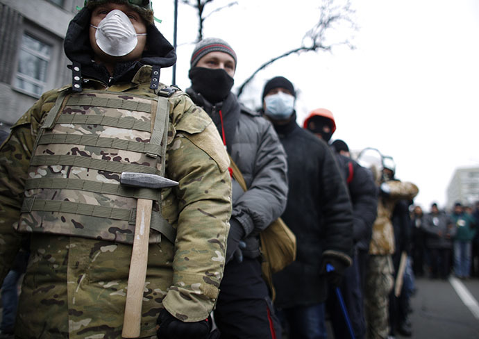 People wear masks as they attend a rally held by supporters of EU integration in Kiev, December 1, 2013. (Reuters / Stoyan Nenov)