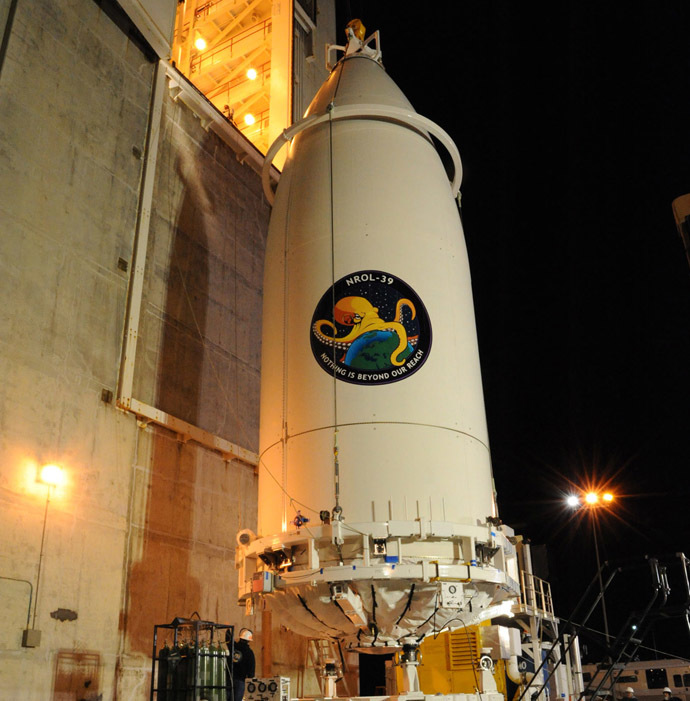 In preparation for launch, the NROL-39 payload, encapsulated within a 5-meter diameter payload faring, is transported and mated to its United Launch Alliance (ULA) Atlas V booster at Vandenberg's Space Launch Complex-3. (Photo from www.ulalaunch.com)