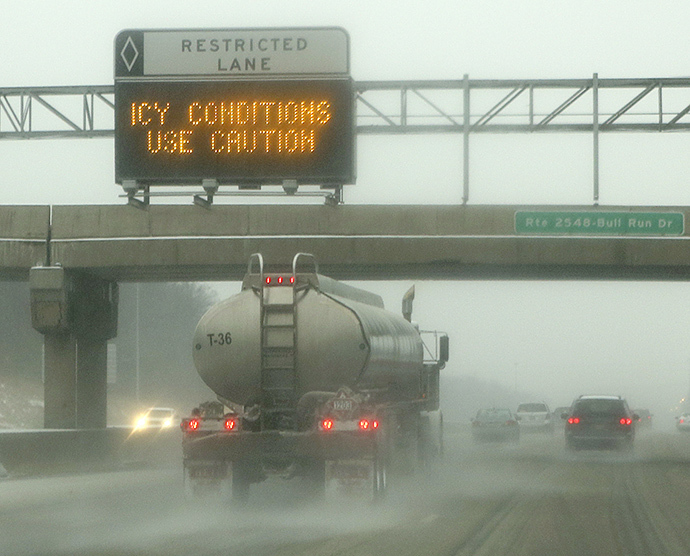 A tanker truck throws icy road spray on Interstate 66 in Manassas, Virginia outside of Washington December 8, 2013. (Reuters / Gary Cameron)