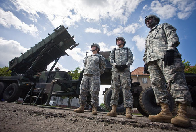 US soldiers stand in front of a Patriot missile battery at an army base in the northern Polish town of Morag. (AFP Photo / Wojtek Radwanski)