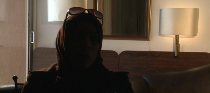 One of the witnesses of the Adra massacre, who spoke to RT on condition of anonymity. Still from RT video