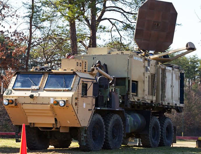A US Marine Corps truck is seen carrying a palletized version of the Active Denial System, March 9th, 2012, at the US Marine Corps Base Quantico, Virginia. It is a US DoD non-lethal weapon that uses directed energy and projects a beam of man-sized millimeter waves up to 1000 meters that when fired at a human, delivers a heat sensation to the skin and generally makes humans stop what they are doing and run. (AFP Photo/Paul J. Richards)