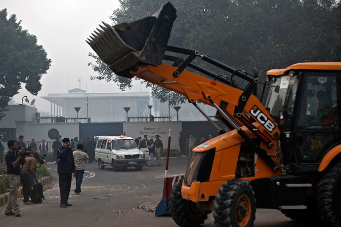 A bulldozer removes the security barriers in front of the U.S. embassy in New Delhi December 17, 2013.(Reuters / Adnan Abidi)