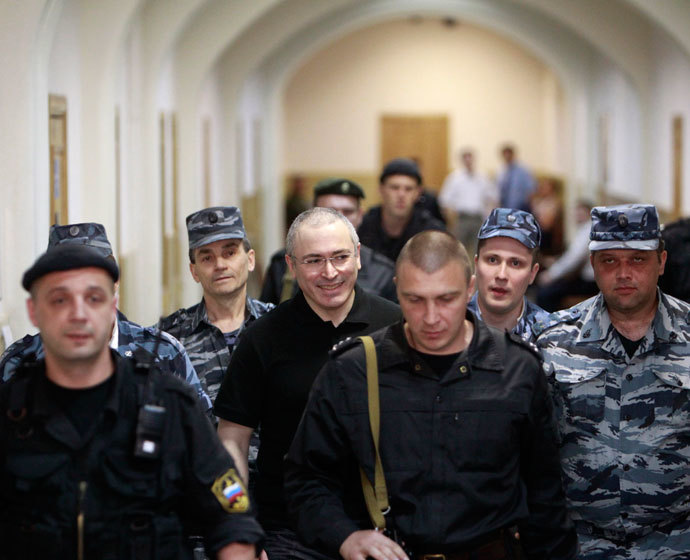 Jailed Russian businessman Mikhail Khodorkovsky (C) is escorted to court in Moscow June 2, 2011.(Reuters / Sergei Karpukhin)