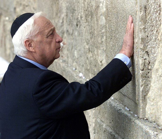 Prime Minister elect Ariel Sharon touches the stones of the Western Wall, also known as the Wailing Wall, as he prays while visiting Judiasm's holiest site in Jerusalem's Old City February 7, 2001, the morning after being elected as Israel's next prime minister. (Reuters)