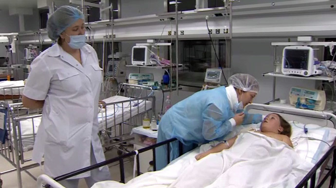 Olya Ivanenko, 9, receiving treatment at a hospital. (Still from RT video)