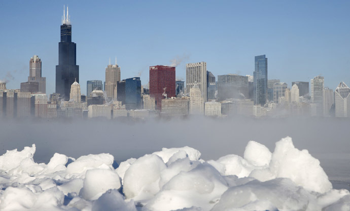 The Chicago skyline is seen beyond the arctic sea smoke rising off Lake Michigan in Chicago, Illinois, January 6, 2014. (Reuters/Jim Young)