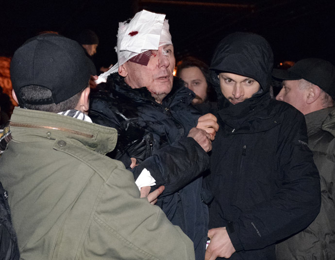 Former Ukrainian Interior and opposition leader Minister Yuriy Lutsenko receives medical help after clashes with riot police near a court in Kiev January 10, 2014. (Reuters)