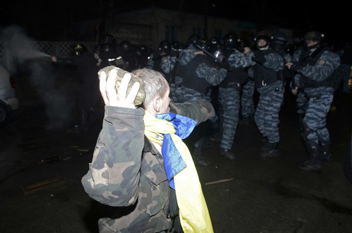 An opposition activist clashes with riot police during a rally near a court in Kiev January 10, 2014. (Reuters/Maks Levin) 
