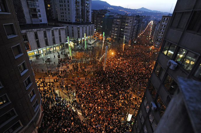 People march during a demonstration called by several Basque political parties, trade unions and social groups in the northern Spanish Basque city of Bilbao on January 11, 2014. (AFP Photo / Rafa Rivas)