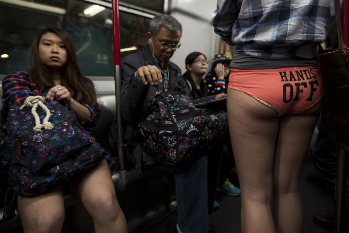 A woman takes part in the annual "No Pants Subway Ride" on a Mass Transit Railway (MTR) train in Hong Kong January 12,2014. (Reuters/Tyrone Siu)