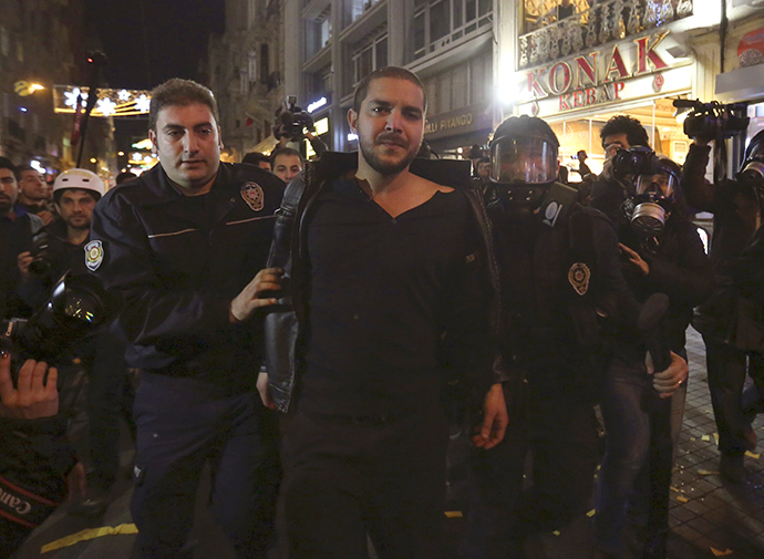 Riot policemen detain a demonstrator during a protest against internet censorship in Istanbul January 18, 2014. (Reuters)