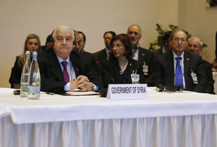Syria's Foreign Minister Walid al-Moualem (L) leads his delegation during a plenary session in Montreux January 22, 2014. (Reuters/Gary Cameron)