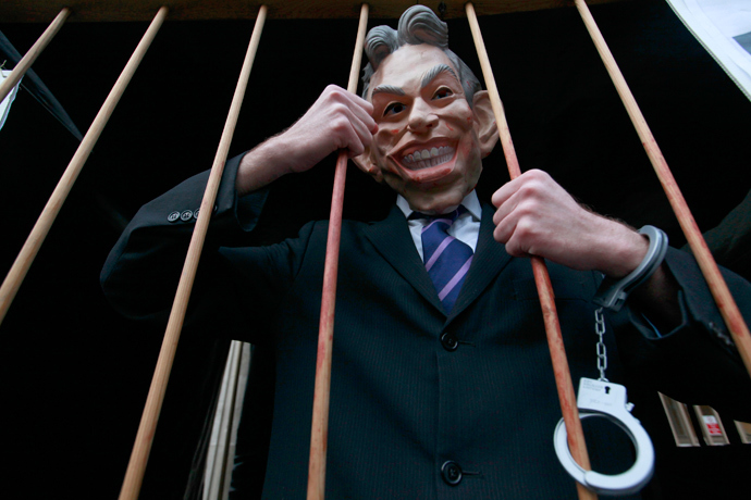 A demonstrator wears a Tony Blair mask outside the Queen Elizabeth II Conference Centre, in central London January 21, 2011. (Reuters / Andrew Winning)