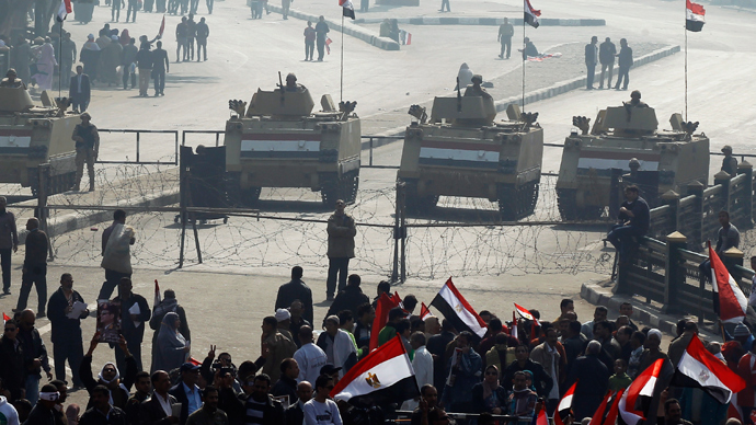 Supporters of Egypt's army and police cheer with national flages in front of Tahrir square in Cairo, , January 25, 2014 (Reuters / Amr Abdallah Dalsh)