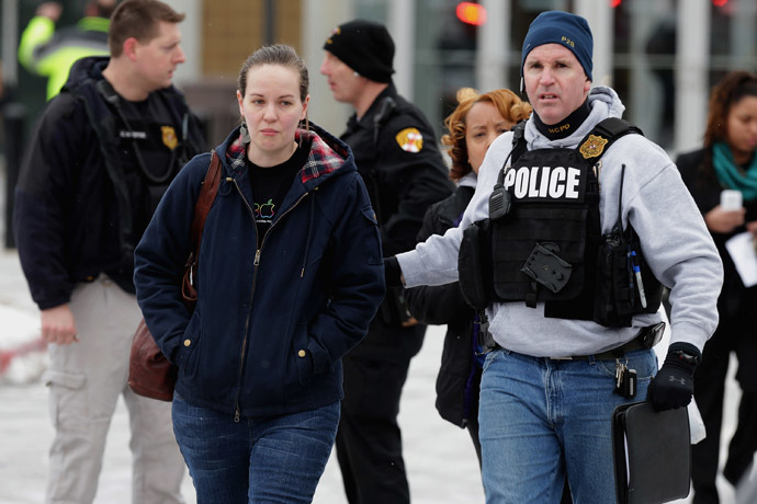Police evacuate employees and patrons from the Columbia Town Center Mall after three people were killed in a shooting there January 25, 2014 in Columbia, Maryland. (Chip Somodevilla/Getty Images/AFP)