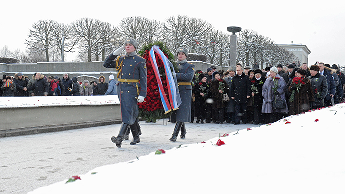 January 27, 2014. Russian President Vladimir Putin, middle ground center, participates in a wreath-laying ceremony at the Motherland memorial at St. Petersburg's Piskaryovskoye Memorial Cemetery. (RIA Novosti / Michael Klimentyev)