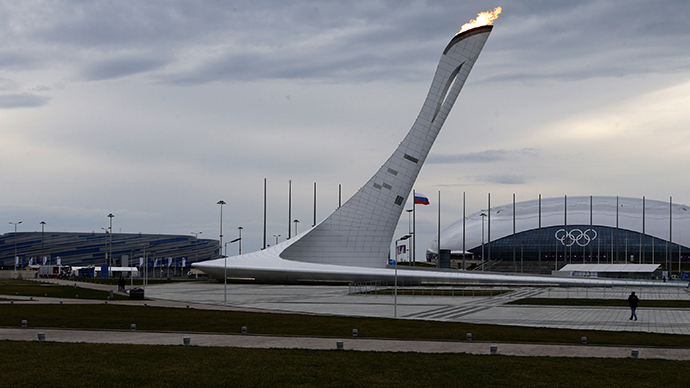 The Olympic flame is tested in its cauldron in front the Bolshoy Ice Dome (R) and Shayba Arena (L) at the Olympic park in the Adler district of Sochi January 27, 2014. (Reuters / Alexander Demianchuk)