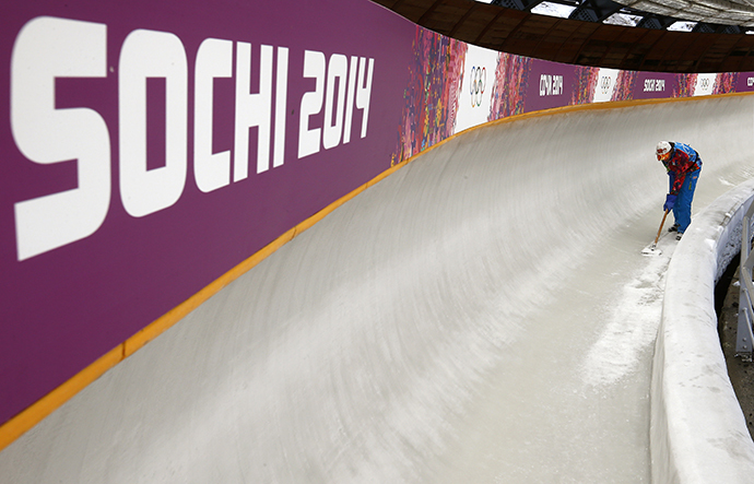A worker prepares the ice track at the "Sanki" sliding center in Rosa Khutor, a venue for the Sochi 2014 Winter Olympics near Sochi January 31, 2014. (Reuters / Arnd Wiegmann)