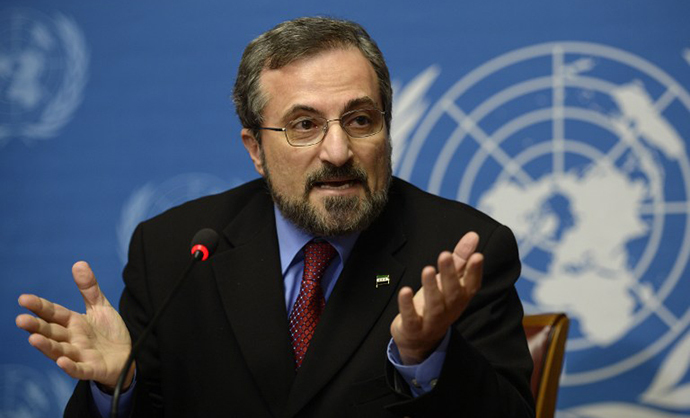 Louay Safi, spokesperson of the Syrian opposition's National Coalition, gestures during a press briefing on peace talks at the United Nations headquarters in Geneva on January 31, 2014. (AFP Photo / Philippe Desmazes)