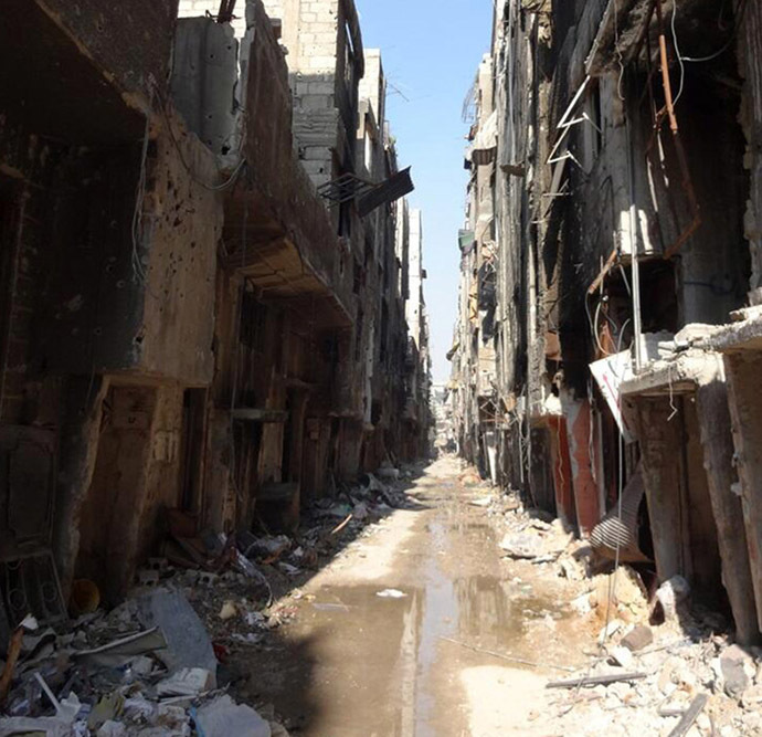 A handout picture released by the United Nations Relief and Works Agency (UNRWA) on January 21, 2014 shows a general view of destruction in Yarmuk Palestinian refugee camp in southern Damascus where the organisation say thousands are trapped and in dire need of aid. (AFP/UNRWA)